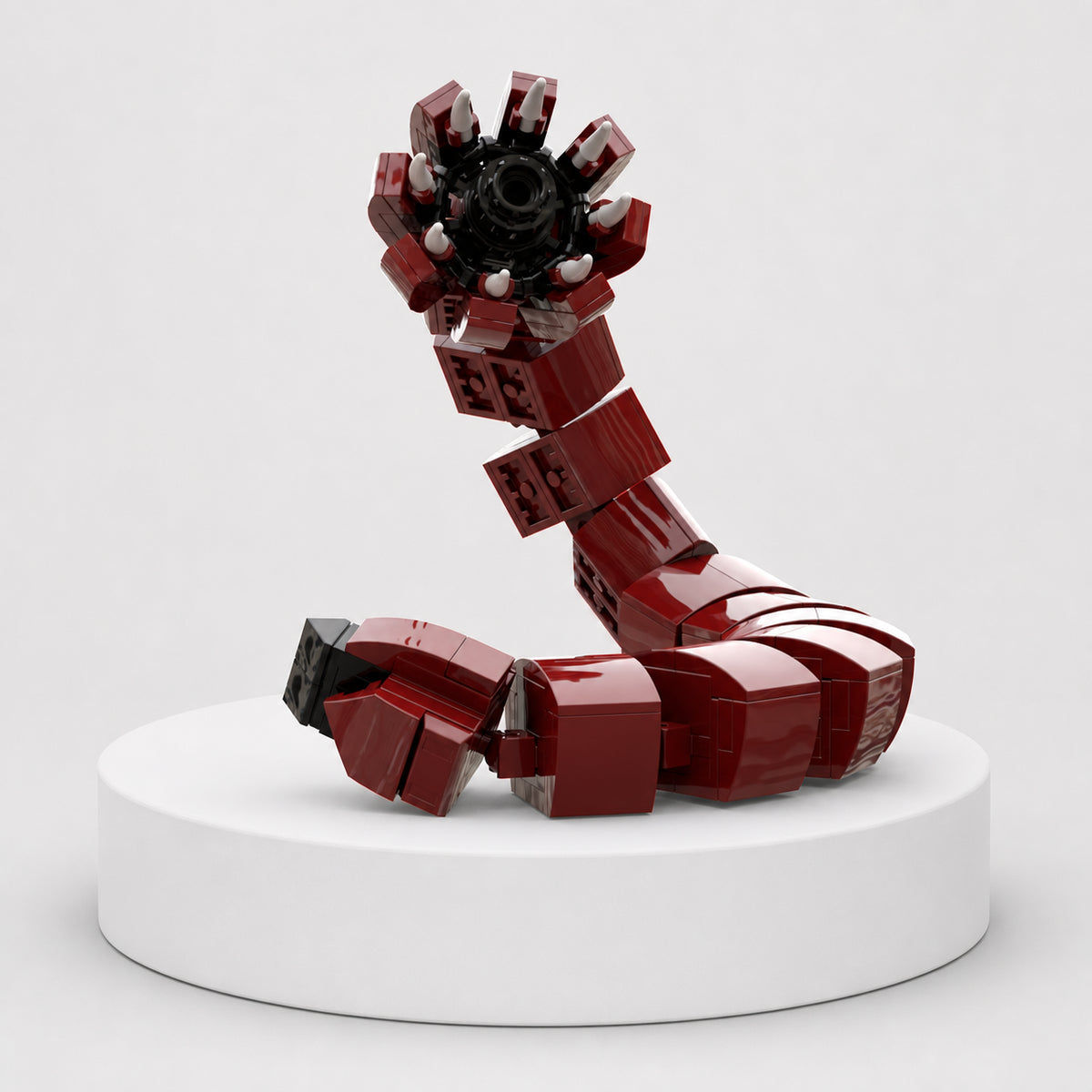 Completed red Mongolian Deathworm brick model featuring a segmented body and tooth-filled circular mouth, built from the 195-piece Northwoods Bricks cryptid set.